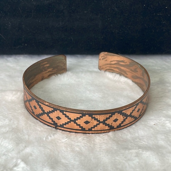 Copper cuff bracelet with black design. - Picture 1 of 6